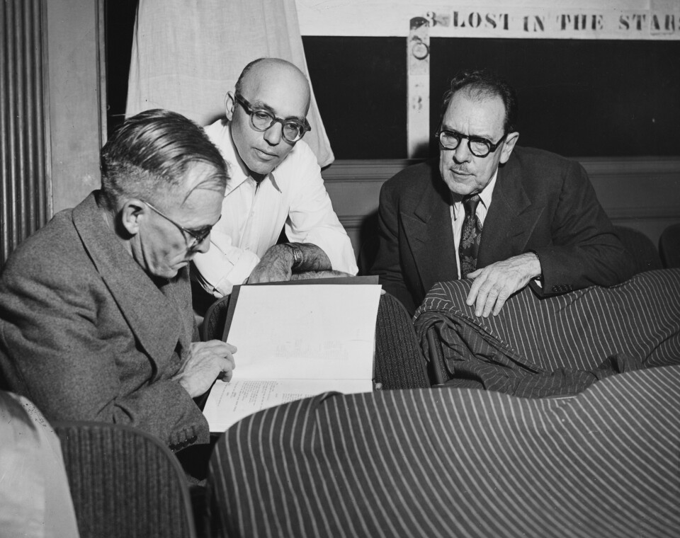 (L-R) Author Alan Paton, composer Kurt Weill and playwright Maxwell Anderson, sitting together reading a script, circa 1950. (Photo by Keystone/Hulton Archive/Getty Images)