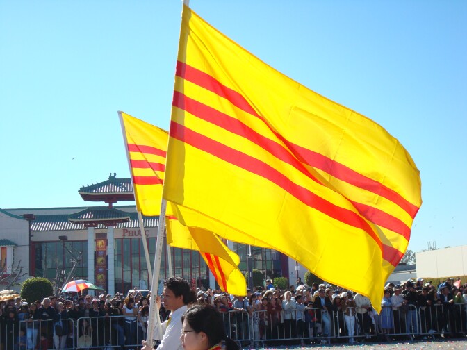 Vietnamese flags wave in Orange County's Little Saigon. High turnout by Vietnamese American voters could help decide a tight county supervisorial race. 