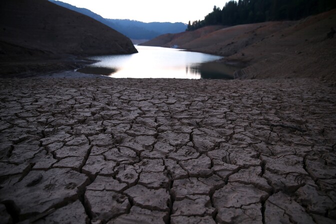 Dry cracked earth is visible on the banks of Shasta Lake at Bailey Cove Aug. 31, 2014 in Lakehead, California. As the severe drought in California continues for a third straight year, water levels in the State's lakes and reservoirs are reaching historic lows.