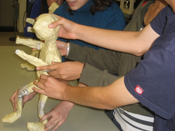 A Cal Arts grad student teaches students about puppetry in a theater arts workshop for English learners at Arroyo Seco Junior High School in Valencia.