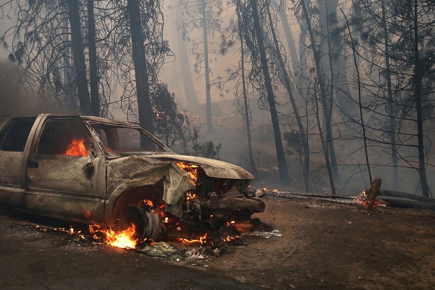 A burned car sits on the side of the road after being consumed by the Rim Fire on August 25, 2013 near Groveland, California. The Rim Fire continues to burn out of control and threatens 4,500 homes outside of Yosemite National Park. Over 2,000 firefighters are battling the blaze that has entered a section of Yosemite National Park and is currently 7 percent contained.  