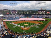 The Stars and Stripes came out as fans sang the National Anthem at Opening Day at Dodger Stadium.