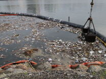 File: Trash in the crook of a boom at the mouth of the L.A. River. 