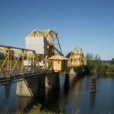 Trucks filled with agricultural products cross a bridge over the Sacramento-San Joaquin River Delta. The so-called Bay Delta Conservation Plan has two "co-equal" goals that are at odds -- restoring the ecosystem while protecting water deliveries to Central Valley farms and Southern California’s growing population.