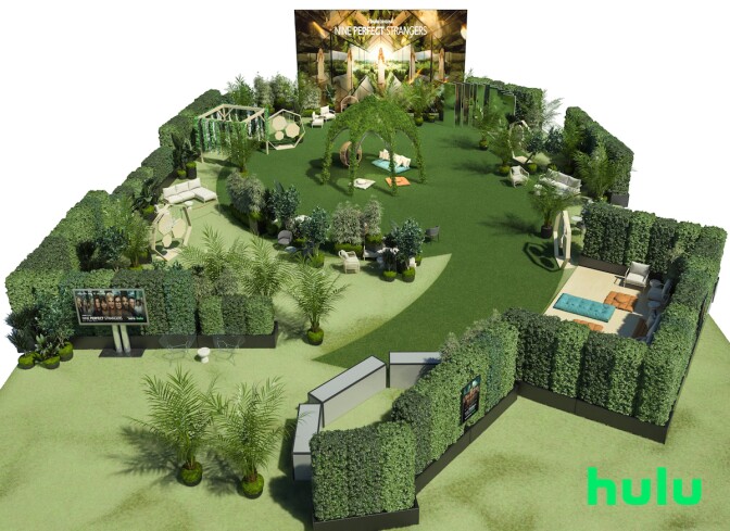 a miniature version of an outdoor space with hedges, a counter, a TV screen and seating