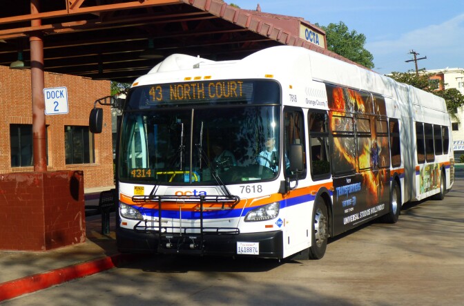 An OCTA bus pulls into a Fullerton station in Orange County. Officials are hoping shorter waits will turn around slumping ridership.