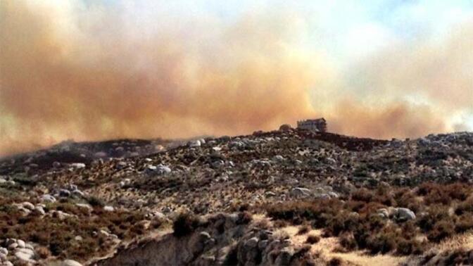 A house threatened by the Silver Fire, Wednesday, Aug. 7, 2013.