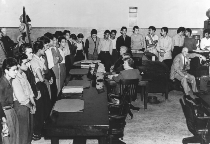 In an unusual procedure, 23 youths were indicted by the County Grand Jury for the gang murder of Jose Diaz, 22, near "Sleepy Lagoon," an abandoned gravel pit near Slauson and Atlantic boulevards. On August 10, 1942 they were arraigned in Superior Judge E. R. Brand's court. 