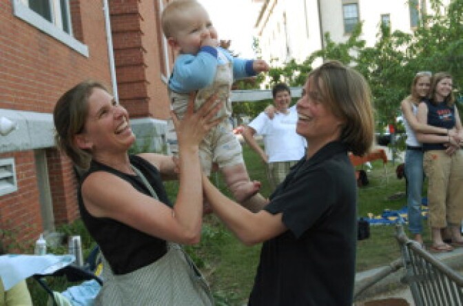 Lara Ramsey (L) and her partner of 8 years, Jane Lohmann (R), play with their seven-month-old son, Wyatt Ramsey-Lohmann, at the City Clerk's office where they applied for a marriage license May 17, 2004 in Northampton, Massachusetts.