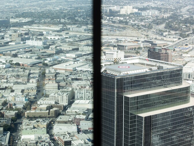 A mirror reflects the view above Los Angeles at 71 Above, the new restaurant on the 71st floor of the U.S. Bank Tower in downtown Los Angeles, on Thursday afternoon, Sept. 22, 2016. The restaurant has views from Malibu to Laguna Hills, along with spectacular views of the Los Angeles basin and the surrounding mountain ranges.