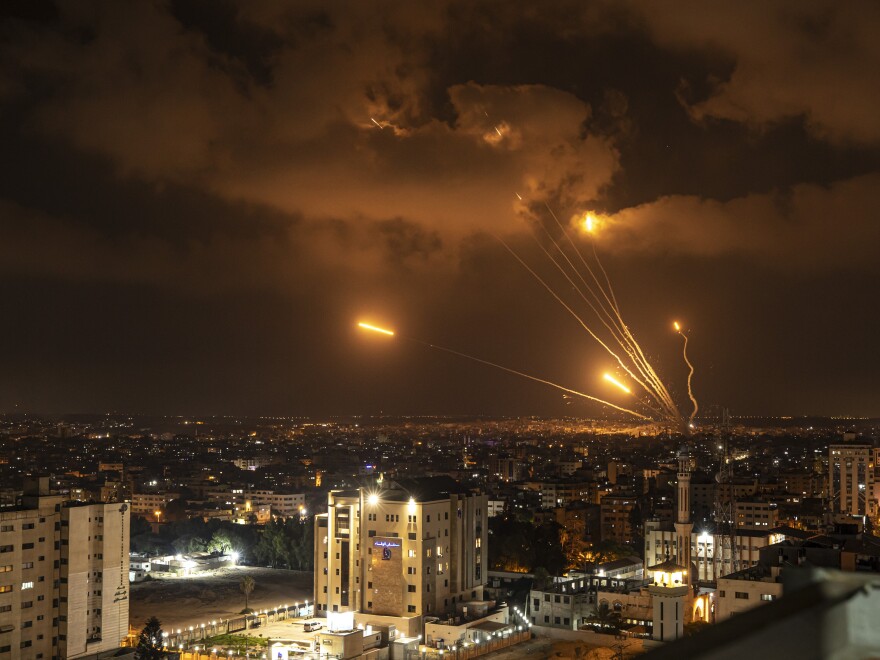 Rockets fired by Palestinian militants toward Israel, in Gaza City, Friday, Aug. 5, 2022. Palestinian officials say Israeli airstrikes on Gaza have killed at least 10 people, including a senior militant, and wounded 55 others.