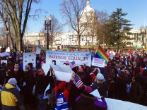 Supporters and opponents of same sex marriage gather in front of the U.S. Supreme Court on Tuesday, March 26 before oral arguments on the legality of California's Prop 8.