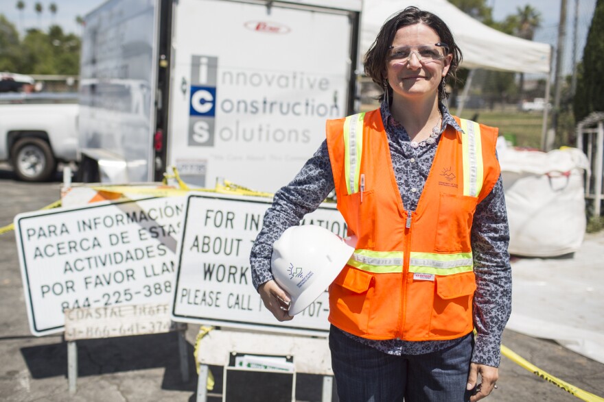 Sarah Cromie is senior environmental scientist at the California Department of Toxic Substances Control. Cromie stands outside a soil removal, part of the Exide cleanup through the department, at an East Los Angeles home on Wednesday, April 20, 2016.