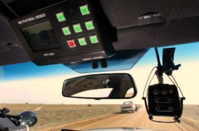 Deputy Sheriff Kirk Ives checks his in-car camera while he patrols near Pratt, Kansas.