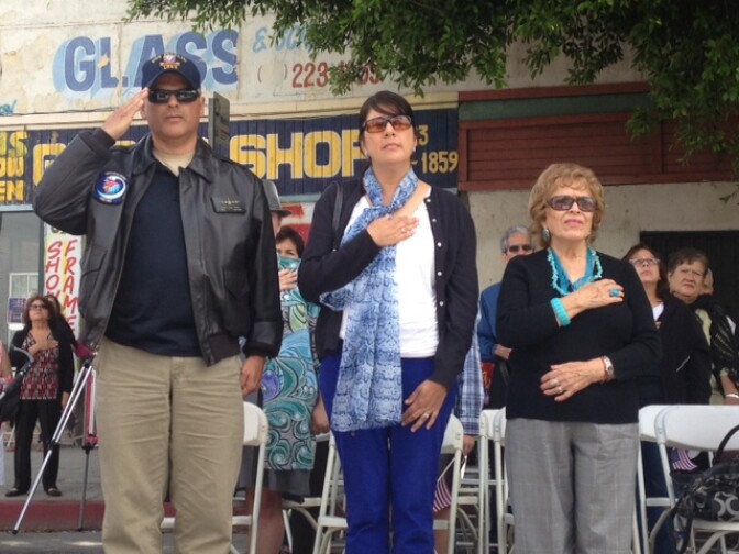 Veterans from the Marine Corp and Air Force salute the American flag during the singing of the national anthem during a Memorial Day ceremony held at the Cypress Park Veterans Memorial in the East Los Angeles. 