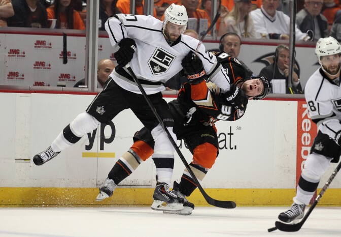 Alec Martinez #27 of the Los Angeles Kings checks Matt Beleskey #39 of the Anaheim Ducks in the third period of Game One of the Second Round of the 2014 NHL Stanley Cup Playoffs at Honda Center on May 3, 2014 in Anaheim, California. The Kings defeated the Ducks 3-2 in overtime.  