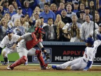 Los Angeles Dodgers' Carl Crawford slides safely past St. Louis Cardinals catcher Yadier Molina during the eighth inning of Game 3 of the National League baseball championship series Monday, Oct. 14, 2013, in Los Angeles.