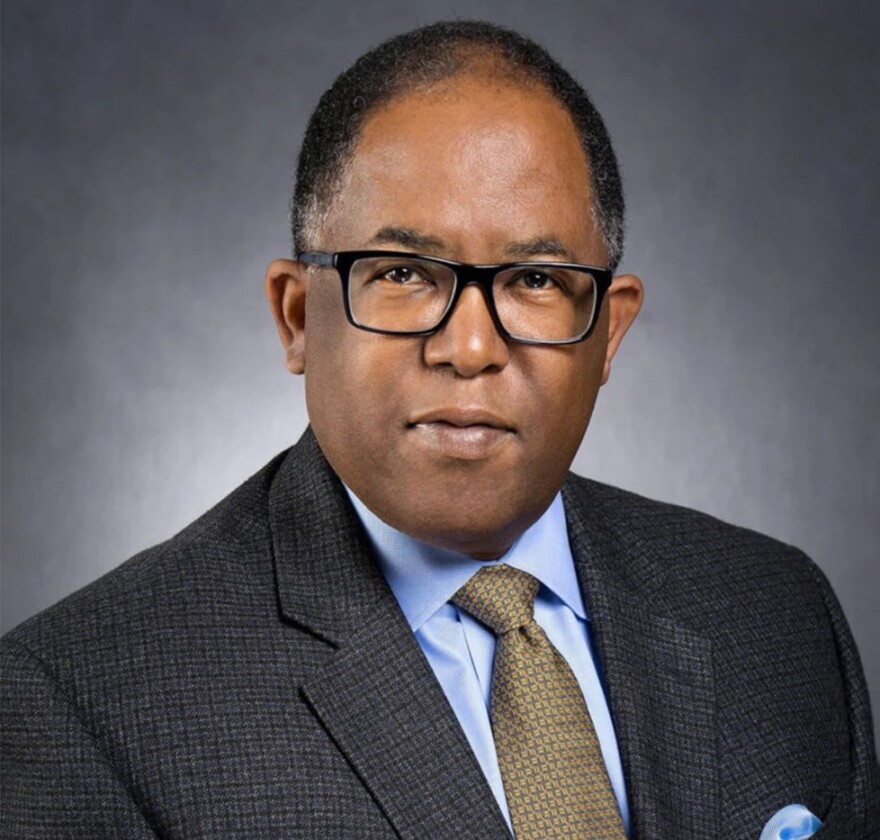 Los Angeles City Councilmember Mark Ridley-Thomas is photographed in a headshot wearing a charcoal suit, blue shirt and tie.