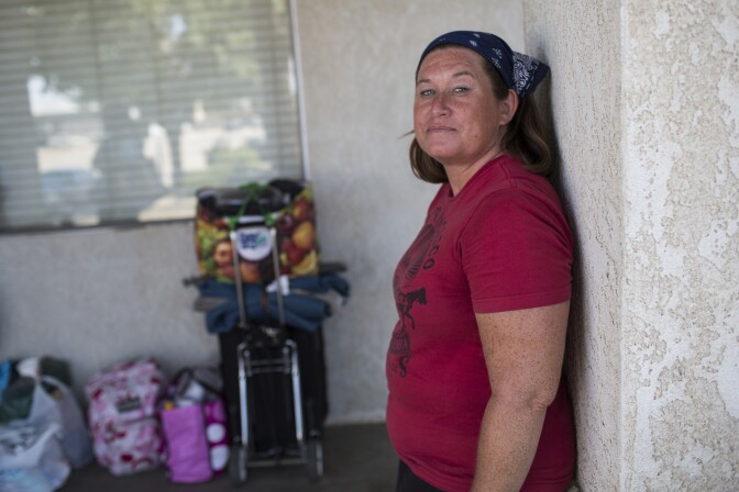 Victoria Burton, 44, has been homeless in the Antelope Valley since October. Burton waits in line for shelter on Tuesday afternoon, May 31, 2016 at Grace Resource Center's Lancaster Community Homeless Shelter.