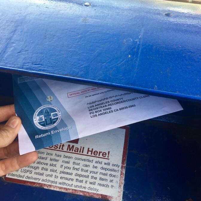 A voter sends his absentee ballot in the mail on Monday. More than half of California voters send their ballots in by mail, according to the office of the California Secretary of State.