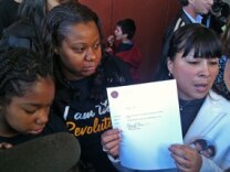 Compton Unified parent Ismenia Guzman, on right, holds receipt given by school district for petitions to turn McKinley Elementary into a charter school under California's new parent trigger law. Celerity Educational Group would run the campus as a charter if the petitions are approved.