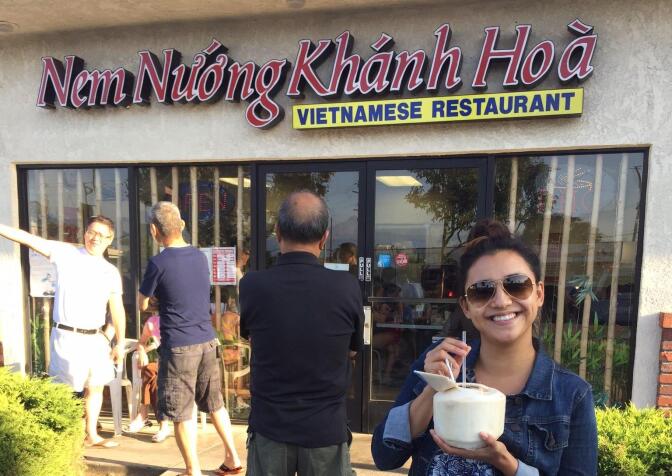 KPCC listener Chelsea Alcantara stands in front of her local – and favorite – pho restaurant
