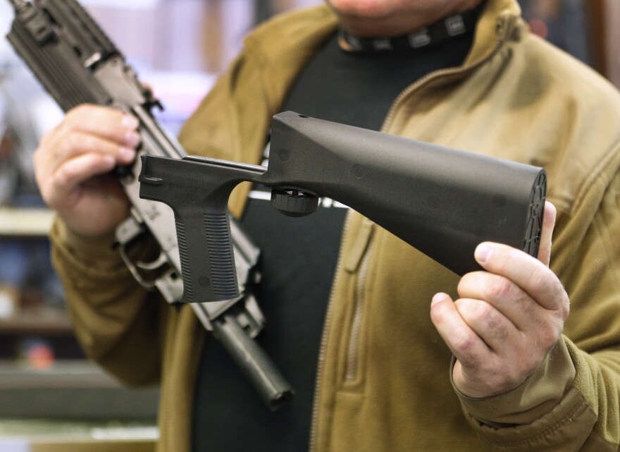 SALT LAKE CITY, UT - OCTOBER 5: A bump stock device (right), that fits on a semi-automatic rifle to increase the firing speed, making it similar to a fully automatic rifle, is shown next to a AK-47 semi-automatic rifle (left) at a gun store on October 5, 2017 in Salt Lake City, Utah. Congress is talking about banning this device after it was reported to of been used in the Las Vegas shootings on October 1, 2017.  (Photo by George Frey/Getty Images)