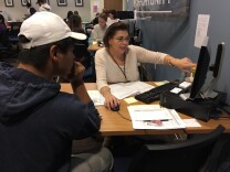 Aimee Meraz with Public Counsel in Los Angeles assists Cesar, 20, in filling out his application for renewal of Deferred Action for Childhood Arrivals, or DACA.