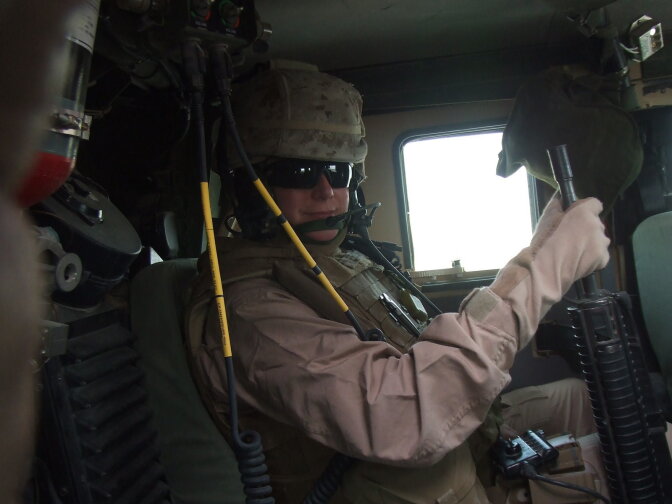 Then-Major Kristi Ericson riding in a tactical vehicle during combat operations in Iraq.