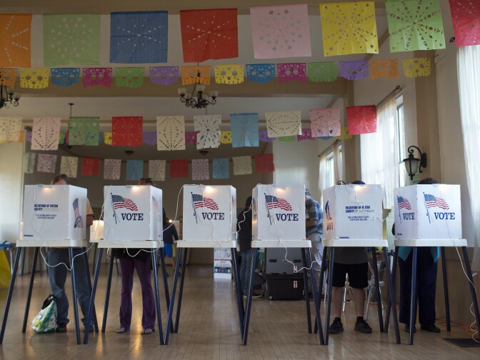 Los Angeles County residents vote inside All Saints Episcopal Church in Highland Park during election day on Tuesday afternoon, Nov. 4, 2014.