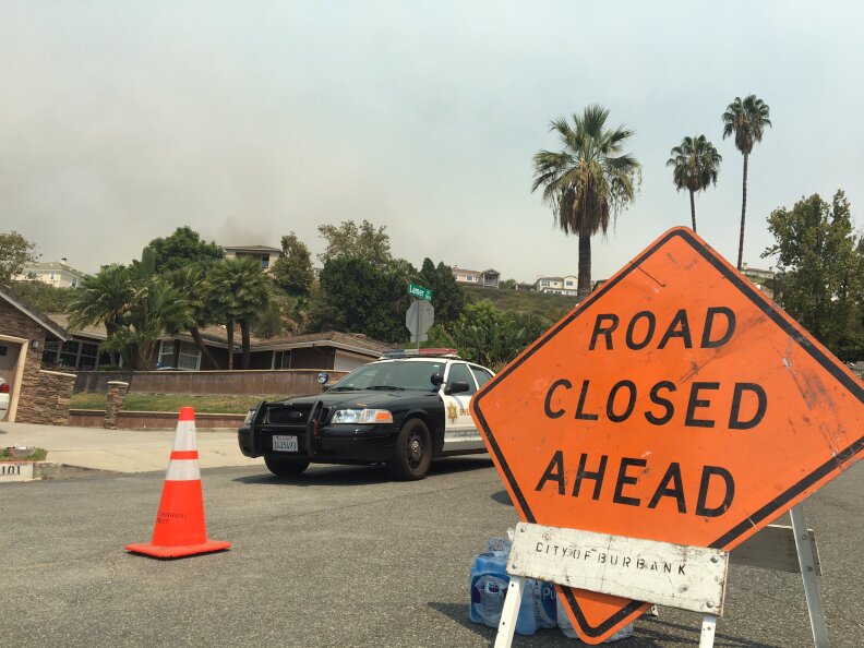 Many roads have been blocked off roads and the smoke is thick near the La Tuna Fire, burning in the hills above Burbank, early September 2, 2017.
