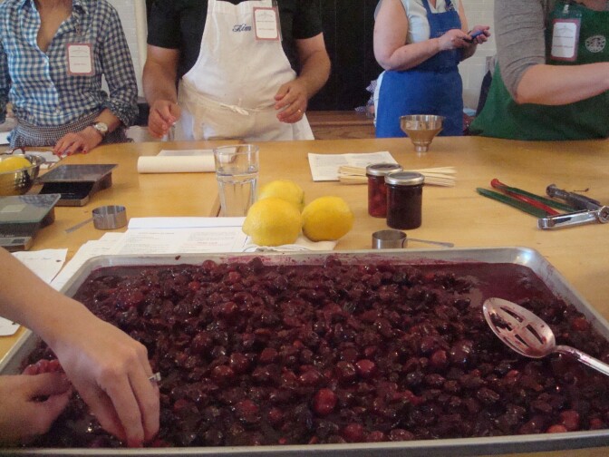 Pitting cherries to make cherry chew