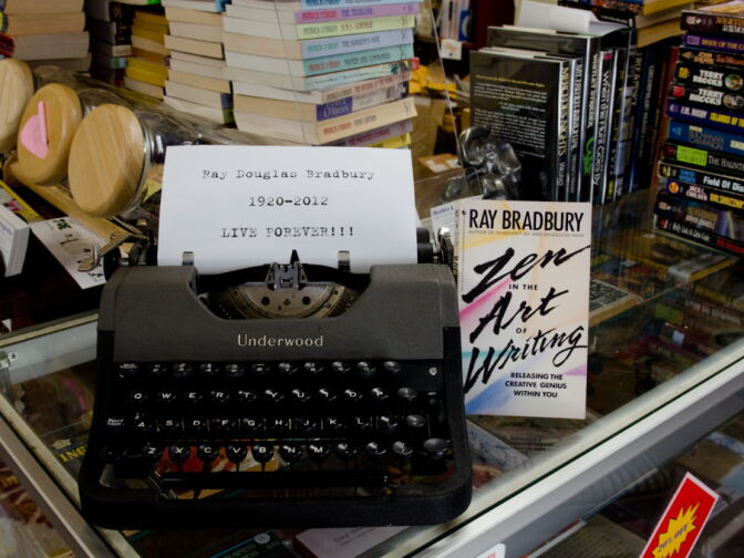 At the enterance of Mystery & Imagination Bookstore, is a tribute to Ray Bradbury, with a typewriter donated by friend and fan, John King.