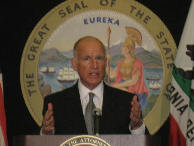 California Attorney Jerry Brown announces he's filing a civil lawsuit against eight current and former city officials in Bell, where big salaries have prompted angry protests.