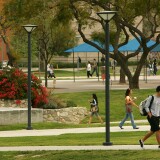 FULLERTON, CA - APRIL 17:  Students walk between classes near the site where the seven people were killed by a gunman on July 12, 1976 inside the California State University, Fullerton library April 17, 2007 in Fullerton, California. Janitor Edward Allaway said later that he went on his killing spree after being taunted by co-workers that gay men were plotting to kill him. Allaway was found innocent by reason of insanity by a judge after the jury was unable to reach a verdict. He remains confined at Patton State Hospital.  (Photo by David McNew/Getty Images)