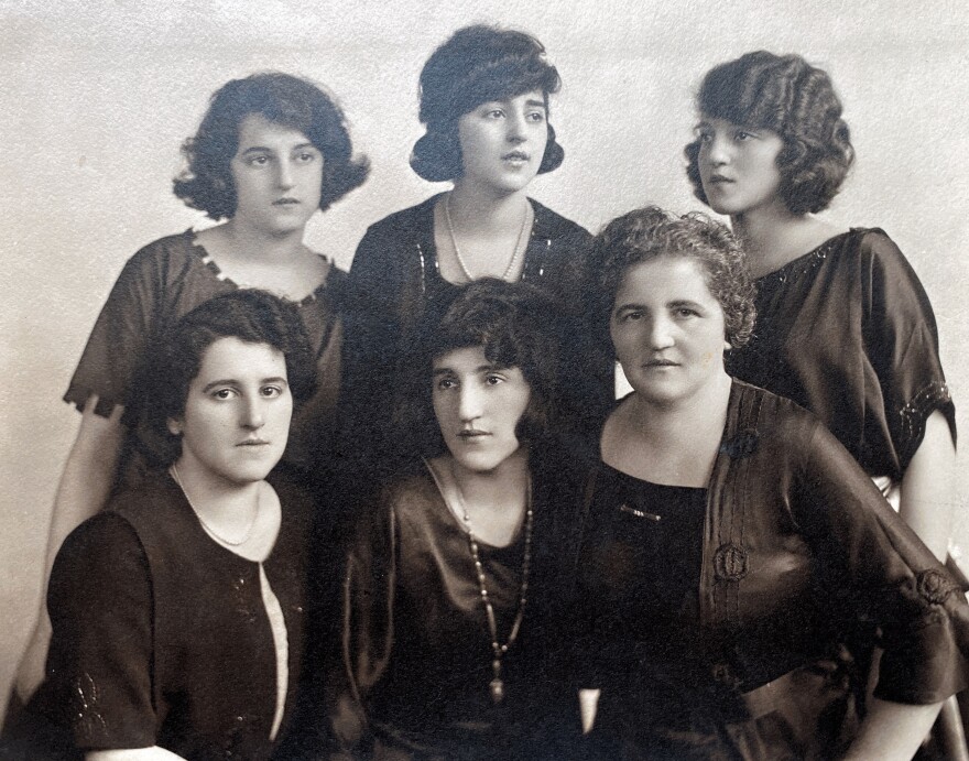 A black and white photo of six women, the Apotheker sisters and their mother. They are dressed in the style of the 1920's, with short hair.