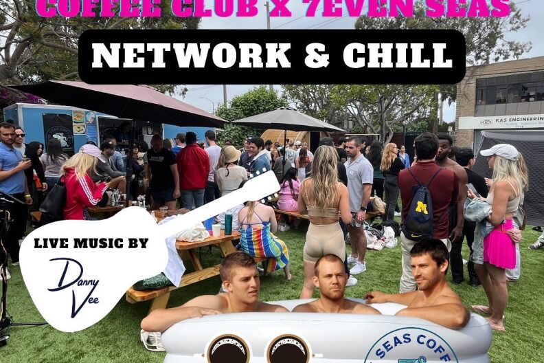 Three men in an inflatable kids pool on a lawn with a crowd of people gathered at food trucks and picnic tables.