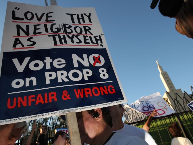 LOS ANGELES, CA - NOVEMBER 6:  Supporters of same-sex marriage protest near the Los Angeles Mormon Temple, seen in the distance, before marching for miles in protest against the Church of Jesus Christ of Latter-day Saints November 6, 2008 in Los Angeles, California. The protest, which began outside the Los Angeles Mormon temple, opposes massive financial contributions to the Proposition 8 campaign, which voters passed and which changes the California Constitution to make gay marriage illegal. When same-sex marriages became legal in California on June 16, conservative churches vowed to fight it and successfully passed Proposition 8 with funds that dwarfed that of their opponents. Demonstrators say the Mormon Church contributed some $35 million to pass the measure.  (Photo by David McNew/Getty Images)