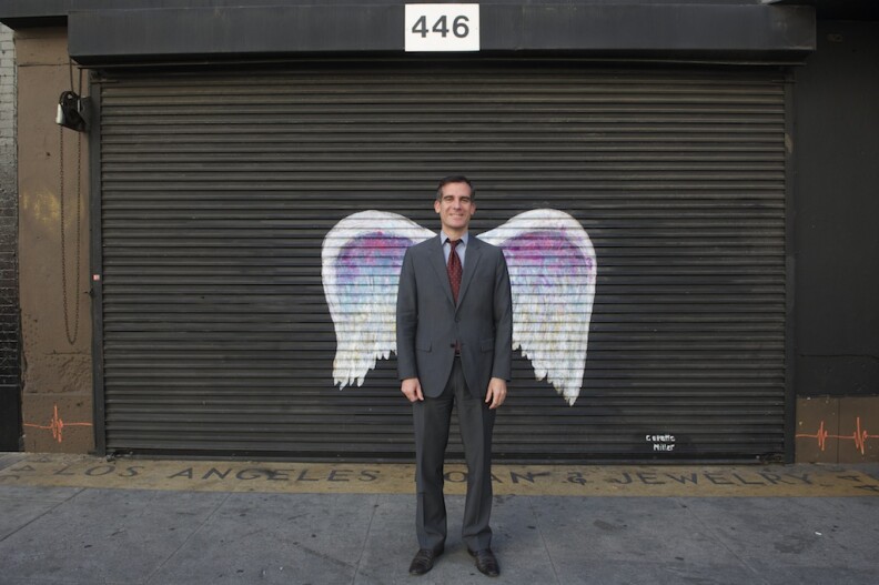 LA City Councilman and Mayoral candidate Eric Garcetti with Collette Miller's wings.