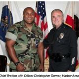 Murder suspect and former LAPD officer Christopher Jordan Dorner in an image with then-LAPD Chief Bill Bratton, in the August 2006 issue of the department's magazine BEAT.