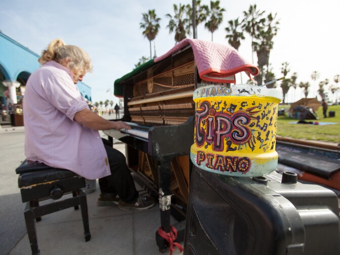 Pianist, Nathan Pino plays for tips on the Venice Boardwalk