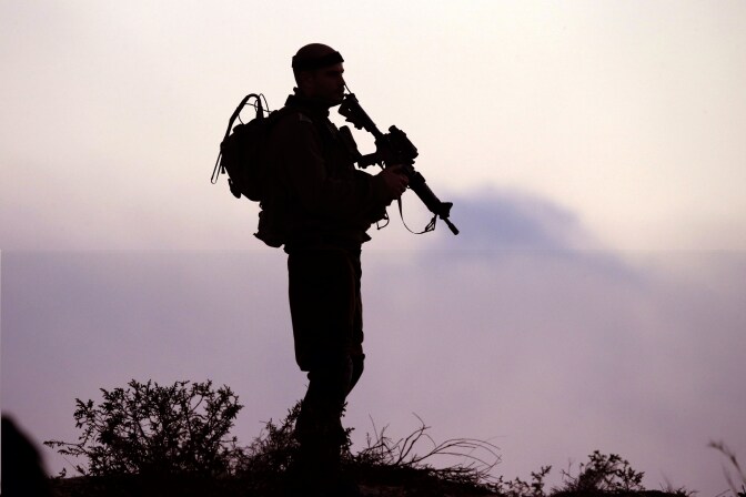 An Israeli soldier keeps his position near Israel's border with the Gaza Strip on July 29, 2014. The Israeli offensive, which began on July 8 to end Hamas rocket attacks on the Jewish state, has killed more than 1,100 Palestinians, mostly civilians according to the United Nations, while 56 lives have been lost on the Israeli side, all but three of them soldiers . 