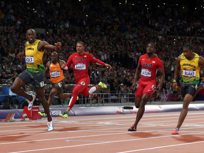 LONDON, ENGLAND - AUGUST 05:  Usain Bolt of Jamaica crosses the finish line to win gold in the Mens 100m Final on Day 9 of the London 2012 Olympic Games at the Olympic Stadium on August 5, 2012 in London, England.  (Photo by Streeter Lecka/Getty Images)