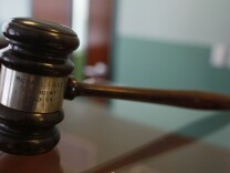 MIAMI - FEBRUARY 02: A judges gavel rests on top of a desk in the courtroom of the newly opened Black Police Precinct and Courthouse Museum February 3, 2009 in Miami, Florida. The museum is located in the only known structure in the nation that was designed, devoted to and operated as a separate station house and municipal court for African-Americans. In September 1944, the first black patrolmen were sworn in as emergency policemen to enforce the law in what was then called the "Central Negro District." The precinct building opened in May 1950 to provide a station house for the black policemen and a courtroom for black judges in which to adjudicate black defendants. The building operated from 1950 until its closing in 1963.  (Photo by Joe Raedle/Getty Images)