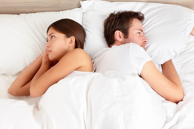 A couple in bed. 
