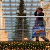 A woman carries shopping bags through a shopping mall on November 22, 2010 in Berlin, Germany.