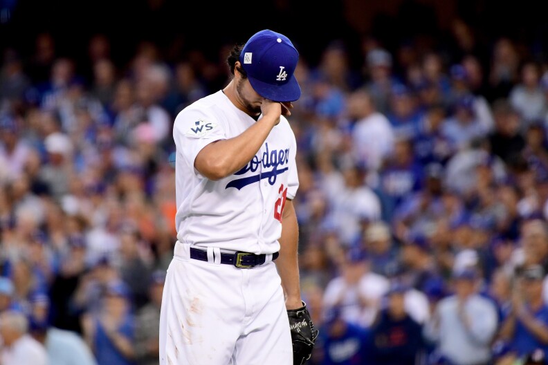 Yu Darvish #21 of the Los Angeles Dodgers reacts in the first inning against the Houston Astros in game seven of the 2017 World Series at Dodger Stadium on Nov. 1, 2017.