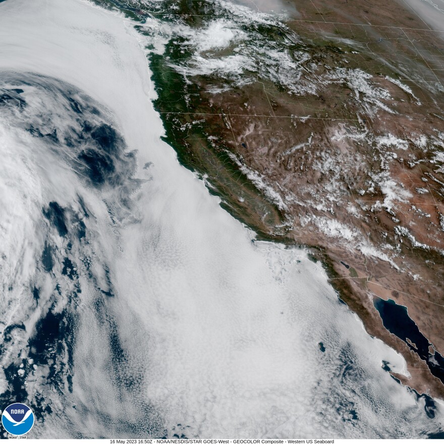 The skies over the Pacific Ocean are almost solid white cloud cover in this satellite view of the California coast