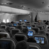 Passengers watch their television during flight 