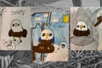 Three kids drawings of bald eagles are sitting on top of a black and white background.
